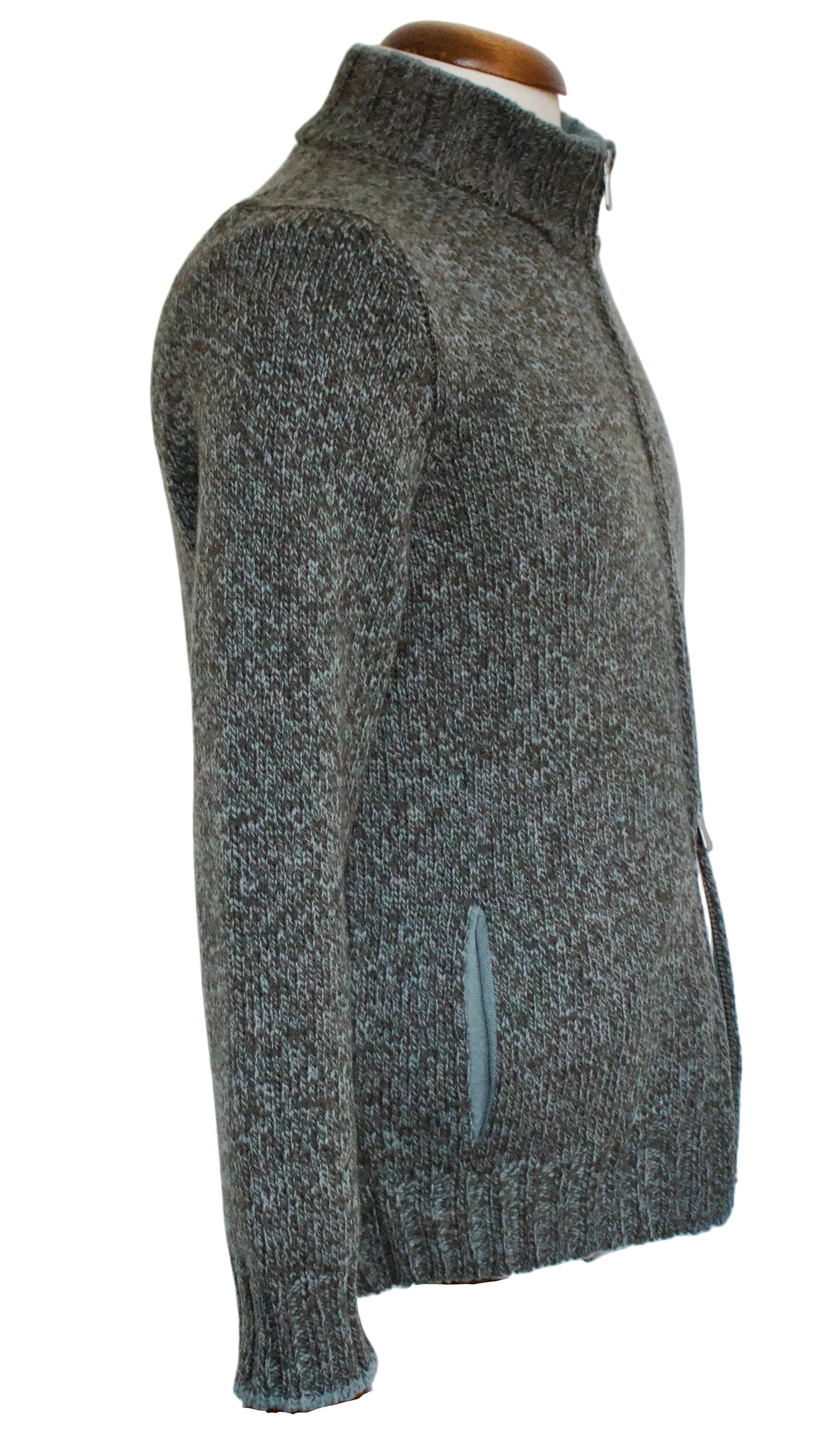 A green and brown knit zip-up sweater with a mock neck collar, displayed on a wooden dress form mannequin against a plain white background.