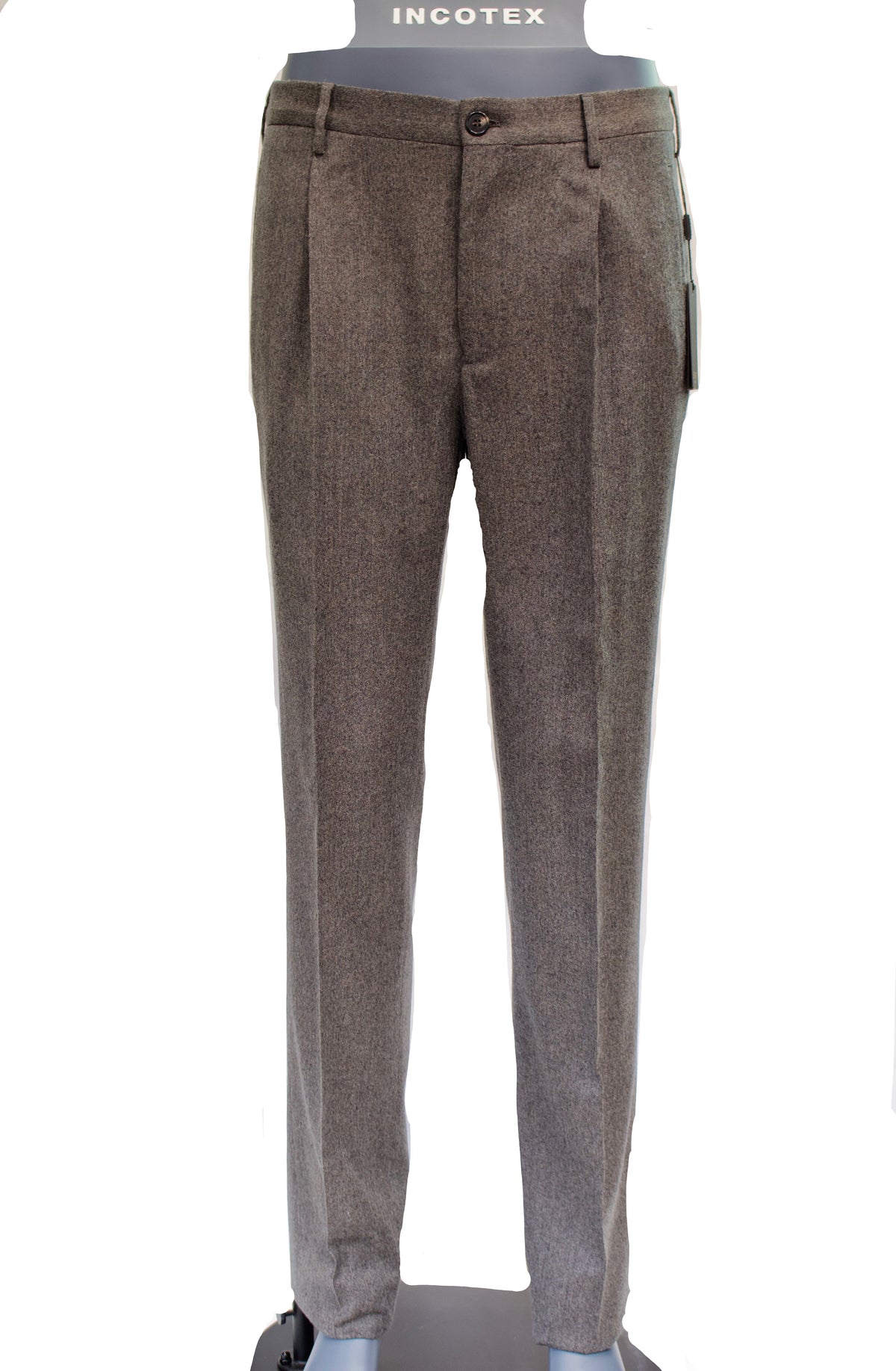 Brown textured pants on a mannequin with a white background