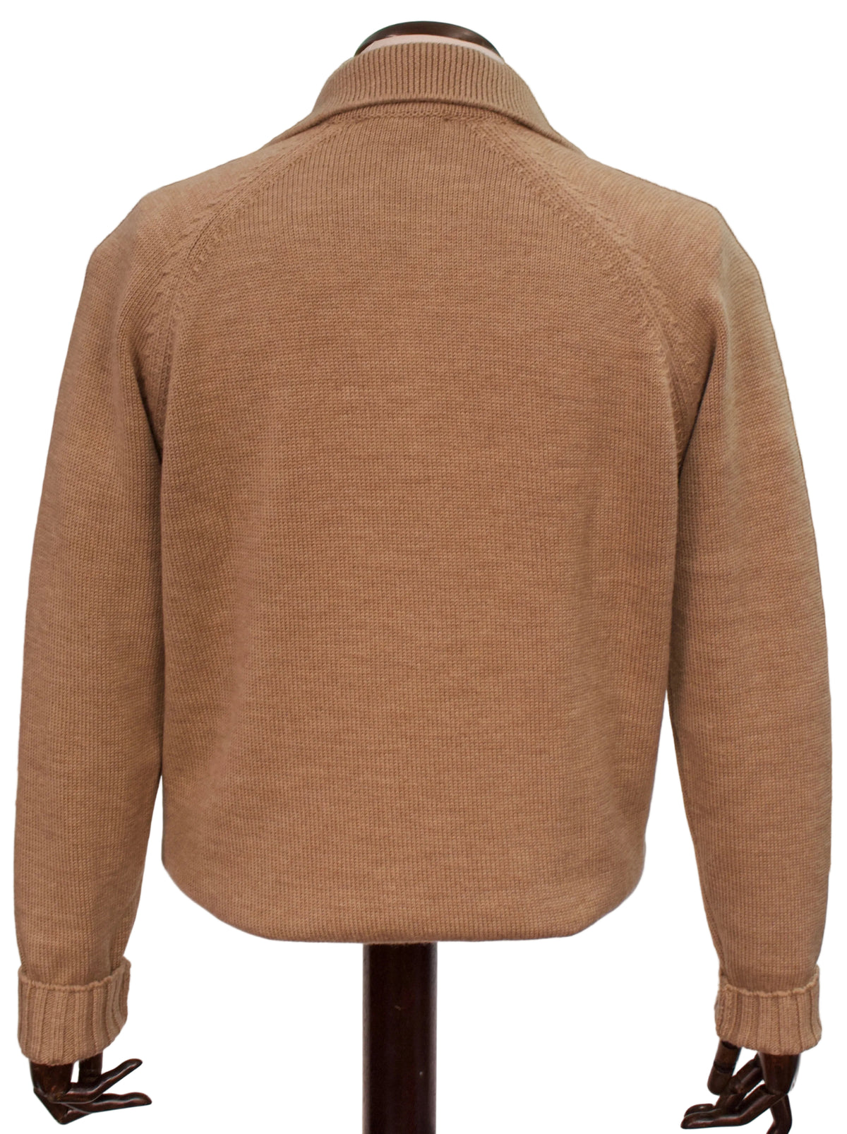 A tan ribbed knit sweater displayed on a mannequin from the back, with a cuffed collar and raglan sleeves, set against a white background.