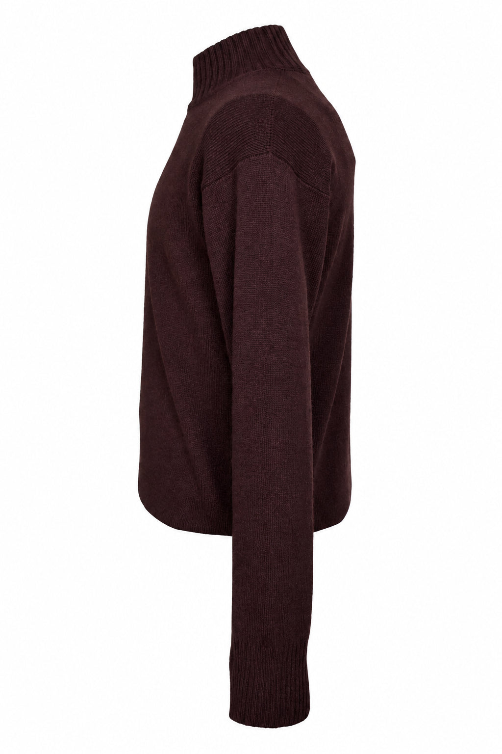 A dark burgundy knit sweater displayed on a dress form mannequin in an indoor studio or showroom setting.