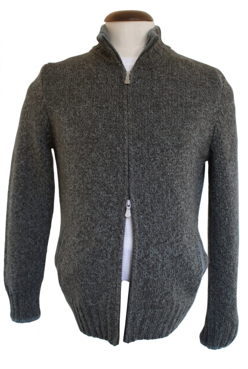 A green and brown textured knit zip-up sweater displayed on a mannequin torso against a plain light background.
