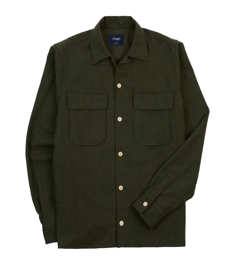 Drake's Dark green shirt with button details on a light beige background